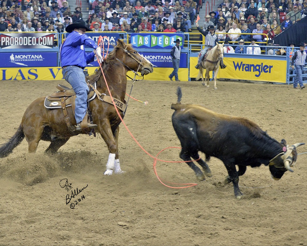 Jake Long, Coffeyville, Kansas, shows his championship heeling form from the back of his sorrel Quarter Horse Colonel as he moved up from ninth to third in the world standings of the Professional Rodeo Cowboys Association after placing in six go-rounds at the National Finals Rodeo in Las Vegas. With heeler Coleman Proctor, Pryor, Oklahoma, lifelong friend since a family movie was made of them roping a practice dummy during a rodeo 25 years ago, the team placed fourth in the average at the finals’ team roping. (Photo courtesy of Brenda Allen, arp@allensrodeophotos.com.)